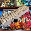 Detailed view of wooden bunny thread bobbins and colorful embroidery floss in storage box. - Rabbit (With Box Without Thread)