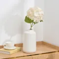 Artificial hydrangea flower with white ceramic vase for home decor and party decoration. - Cream
