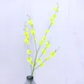 Artificial dancing orchid flower branch in glass vase, elegant yellow floral home decor. - Yellow