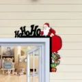 Christmas wooden door corner decoration detail showing Santa Claus and gift boxes in a cozy room. - HO Santa Claus