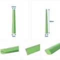 Green sauce packet squeezer kitchen tool with dimension guides for easy food waste reduction. - Green
