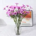 Künstlicher lilafarbener Gänseblümchen Blumenstrauß in klarer Glasvase für Heimdekoration Hochzeit - Dunkellila