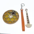 Portable wooden wrist yarn holder with honeycomb and bee design, perfect for knitting. - Bee