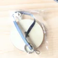 Portable wrist yarn holder wooden base with dark blue leather strap and metal ring. - Natural Wood Color
