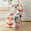 Cotton gauze bath towel variant with abstract geometric and smiling face pattern design. - 70*140cm / Fuji
