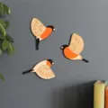 Wooden flying bird wall hanging decoration, set of 3 orange and black bird home decor ornaments. - Bullfinch