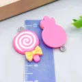 Adorable rose red resin lollipop charms for DIY jewelry making with ruler for scale - Bow Lollipop (24472)