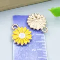 Detail view of yellow enamel sunflower daisy alloy pendant shown on a measurement scale - Little Daisy (14784) / 1 Piece (13x16mm)