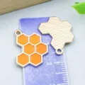 Macro detail of honeycomb enamel pendants with size scale reference for DIY jewelry - 1 Piece/Pack (16x20mm)
