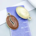 Gedetailleerd overzicht van bruin emaille koffieboon hanger voor DIY sieraden ketting - Koffieboon (21150) / 1 Stuk (20*12mm) / koffiekleur