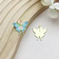 Detail view of colorful butterfly charms showing front enamel and gold metal back texture - Tulip Flower Butterfly (18108) / 1 Piece (23x25mm) / Lake Blue