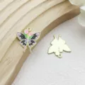 Detailed view of enamel butterfly charms with floral design and golden back finish - Tulip Flower Butterfly (18109) / 1 Piece (23x25mm) / Purple