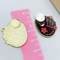 Detailed baseball glove enamel pendant charm shown with a pink measuring ruler for scale - 1 Piece/Pack (26*24mm) / Brown Baseball Glove