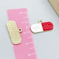 Red and white enamel pill charm with heartbeat line for DIY medical jewelry - Red Pill Shape