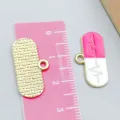 Handmade pink enamel medical pill capsule charm pendant for DIY jewelry crafting - 1 Piece (23*12mm)