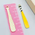 Yellow enamel baseball bat alloy charm next to a pink ruler for scale measurement - 1 Piece (43*7mm) / Yellow Baseball Bat