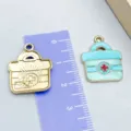 Breloques sac médical émail bleu clair et pendentifs dorés pour bijoux DIY - 1 Pièce/Paquet (22x18mm)