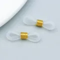 Weiße rutschfeste 8-förmige Brillenhalter aus Silikon mit goldenen Metallspiralen - Rutschfeste Silikon-Brillenschnalle (26271) / 1 Stück (21x7mm) / Gold