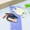 Black enameled graduation cap charm with red tassel and STUDENT text for DIY crafts - STUDENT Doctoral Hat Style (27459) / 1 Piece/Pack (19*26mm) / Orange