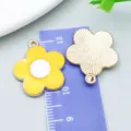 Yellow daisy sunflower enamel pendant charm shown on a ruler for size reference - Sun Flower Frangipani (14752)