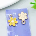 Yellow enamel sunflower charm pendant for DIY jewelry making measured on ruler scale - Sakura Style (14768)
