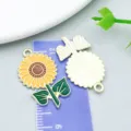 Enamel yellow sunflower pendant with green leaves and gold-tone metal back detail - Thanksgiving Sunflower (19208)