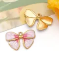 Colgante de lazo de esmalte en oro y rosa para la creación de joyas y collares DIY - 蝴蝶结吊坠(T1627)