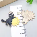 Detailed close-up of black cat hugging a sun enamel charm with ruler showing 3cm size - Sun Cat Style (18122) / 1 Piece/Pack (28*25mm) / Black