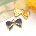 Par de colgantes de lazo de acero inoxidable con esmalte negro y acabado dorado para joyería DIY - 蝴蝶结吊坠(T1642)