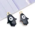 Dainty black enamel Hamsa Evil Eye pendant with a gold-tone stainless steel border - Black