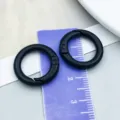 Two matte black alloy circular spring gate rings shown on a ruler for size reference - Thick Spring Clasp (26369) / 1 Piece (OD 20mm ID 13mm) / Black