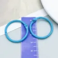 Light blue painted metal loose-leaf binder rings with a ruler for size reference - Blue Painted (26246) / 1 Piece (30mm/25mm)