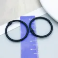 Durable black paint metal binder ring for DIY crafts measured on a purple ruler - Black Painted (26250) / 1 Piece (30mm/25mm)