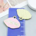 Pink enamel lip-shaped charms with XOXO heart patterns for Valentine's DIY jewelry making - XOXO Lips (27194)