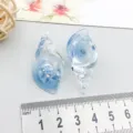 Close-up detail showing blue luminous ocean conch resin pendants with size ruler - Blue Luminous Snail (18954) / 1 Piece (39*19mm) / Blue