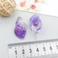 Detailed view of purple resin seashell pendants for DIY jewelry with size ruler - Purple Luminous Snail (18955) / 1 Piece (39*19mm) / Purple