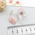 Transparent resin conch shell pendants with natural seashell inclusions for DIY jewelry - Pink