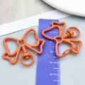 Vibrant orange bow-shaped alloy keychain pendant with heart detail for DIY jewelry - Orange