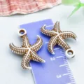 Pendentifs étoiles de mer en acrylique marron et blanc pour la création de bijoux DIY - Étoile de Mer Océan (27392) / Pack de 1 (24x18mm) / Brun et Blanc