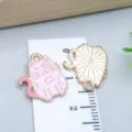 Cute pink enamel cat charm pendant for DIY jewelry making shown with dimension ruler - Cat (25166) / 1 Piece (17x15x1mm) / Light Pink