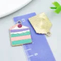 Colorful enamel alloy cake charm front and back view shown with purple measuring ruler - Green Enamel Multicolor Cake (24682)