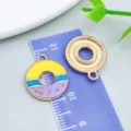 Colorful enamel donut charm for DIY jewelry making and handmade craft projects - Yellow Purple Enamel Donut (24695)