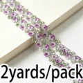 Detailed shot of colorful hollow water-soluble lace embroidery trim for DIY sewing crafts. - Purple