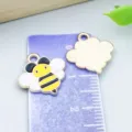 Cute yellow enamel bee charm pendant with golden metal back for DIY necklace jewelry making - 1 Piece (15x15mm)