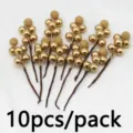 Detailed view of 10pcs artificial gold berry stems for Christmas tree and holiday decoration. - Gold