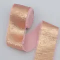 Close-up detail of the pink metallic plush ribbon with frayed edges and shiny gold coating. - Pink