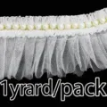 Detail shot of 6cm white pleated lace trim with faux pearls, perfect for wedding dresses. - White
