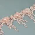 Close up of pink petal lace trim with pearls and delicate flower details, ideal for crafts. - Flesh Pink