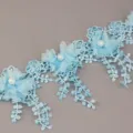 Blue lace trim ribbon with floral design and pearls, ideal for wedding crafts and garment sewing. - Sky Blue
