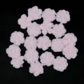 Detail view of 2.5cm pink fabric 5-petal flower appliqués with pearl center for DIY crafts. - 20 Pieces / Pink